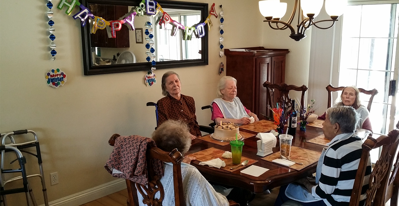Elderly residents dining together